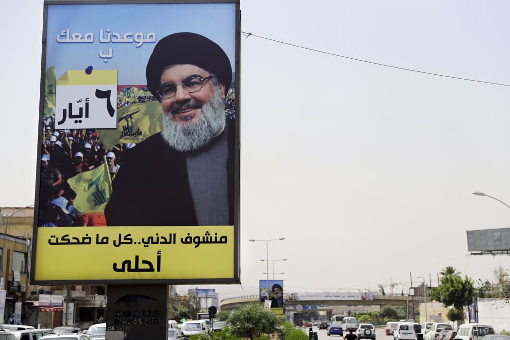 A portrait of chief of the Lebanese Hezbollah movement, Hassan Nasrallah, is fixed on the side of a road in the mainly Shiite Muslim southern suburbs of Beirut.