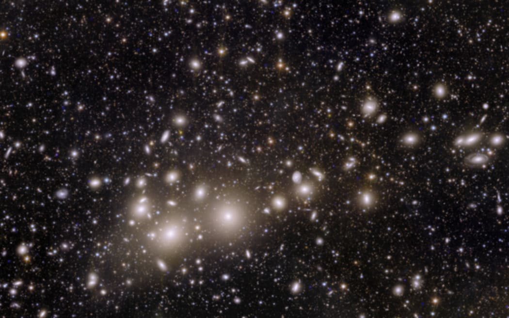 The Perseus Cluster is one of the most massive structures in the Universe. This image contains 1,000 galaxies from this group, but beyond are tens of thousands more galaxies, some of whose light has taken 10 billion years to reach us.