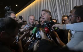 Former Brazilian President Jair Bolsonaro speaks to media after Brazil's federal electoral court barred him from politics until 2030, on 30 June, 2023.