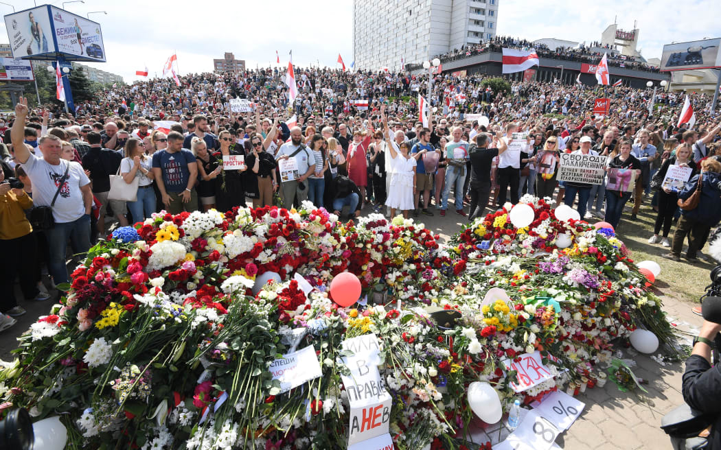 Belarus opposition supporters gather near the Pushkinskaya metro station where Alexander Taraikovsky, a 34-year-old protester died on August 10, during their protest rally in central Minsk, Belarus.