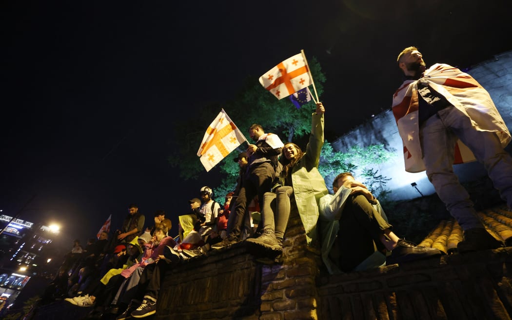 Protesters march during a rally against the controversial "foreign influence" bill in Tbilisi on May 11, 2024. The Black Sea Caucasus nation has been gripped by mass anti-government protests since April 9, after the ruling Georgian Dream party reintroduced the bill, which critics see as repressive. (Photo by Giorgi ARJEVANIDZE / AFP)