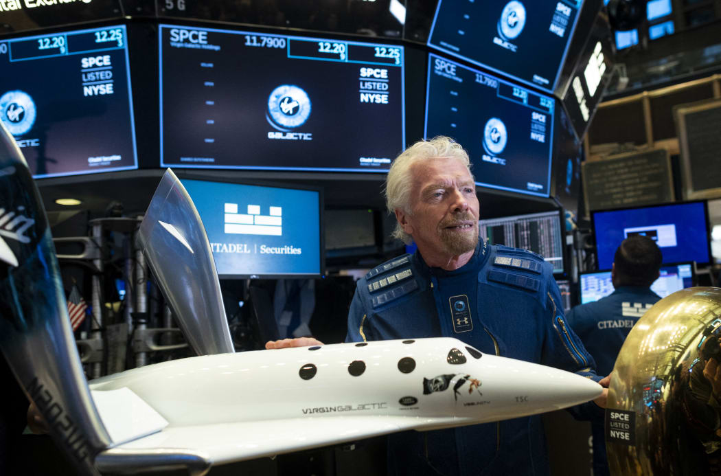 Richard Branson, Founder of Virgin Galactic poses before ringing the First Trade Bell to commemorate the Virgin Galactic's first day of trading on the New York Stock Exchange