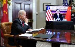 US President Joe Biden meets with China's President Xi Jinping during a virtual summit from the Roosevelt Room of the White House in Washington, DC,