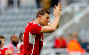 Chris Wood of Nottingham Forest applauds the fans