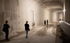 A group of people in a large tunnel.