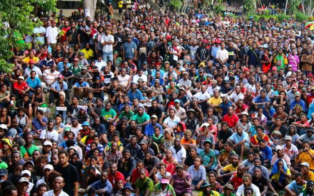 Students attend a rally at UPNG.