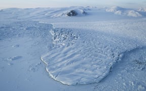 A glacier is seen from NASA's Operation IceBridge research aircraft on March 30, 2017 above Ellesmere Island, Canada. The ice fields of Ellesmere Island are retreating due to warming temperatures.