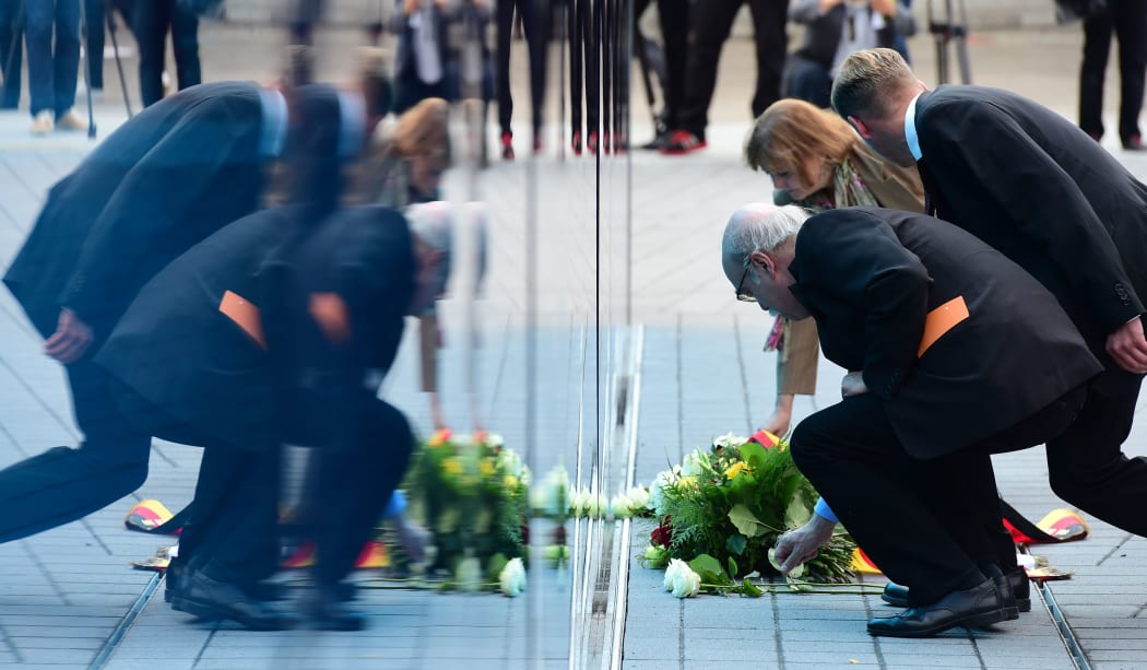 Visitors lay wreaths and flowers at the Berline memorial for the victims of Nazi euthanasia.