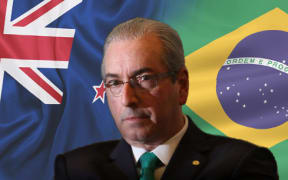 Eduardo Cunha infront of a NZ and Brazilian flag