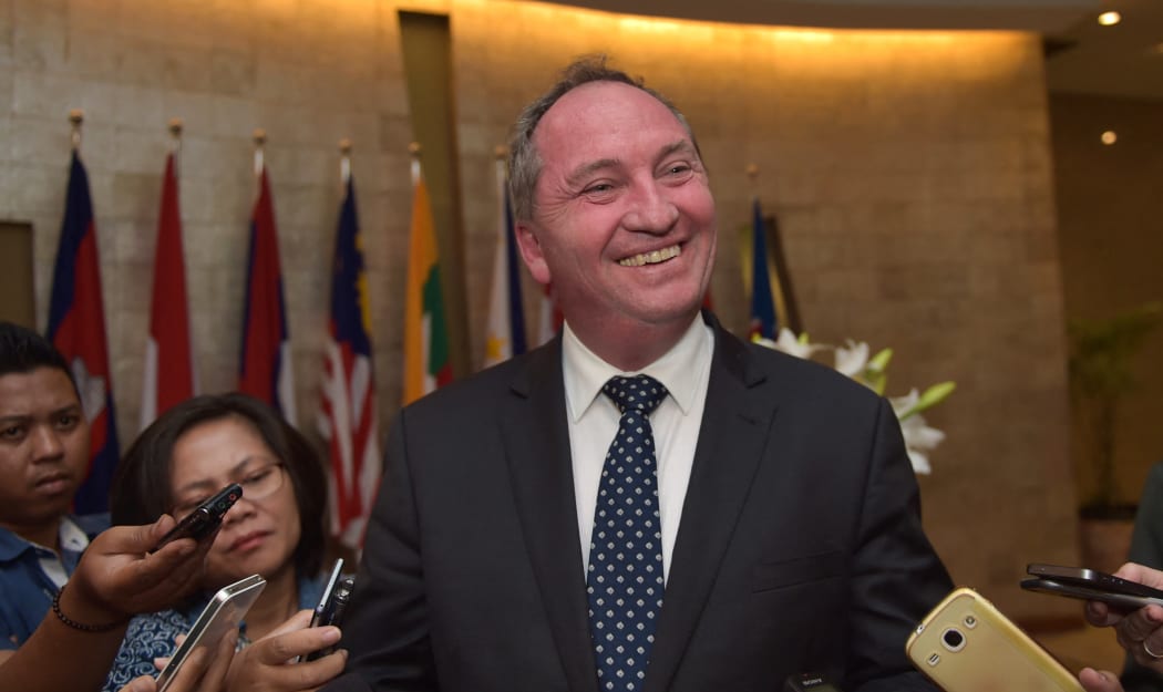 Australia's Agriculture Minister Barnaby Joyce (C) speaks to journalists in Jakarta on October 8, 2015.