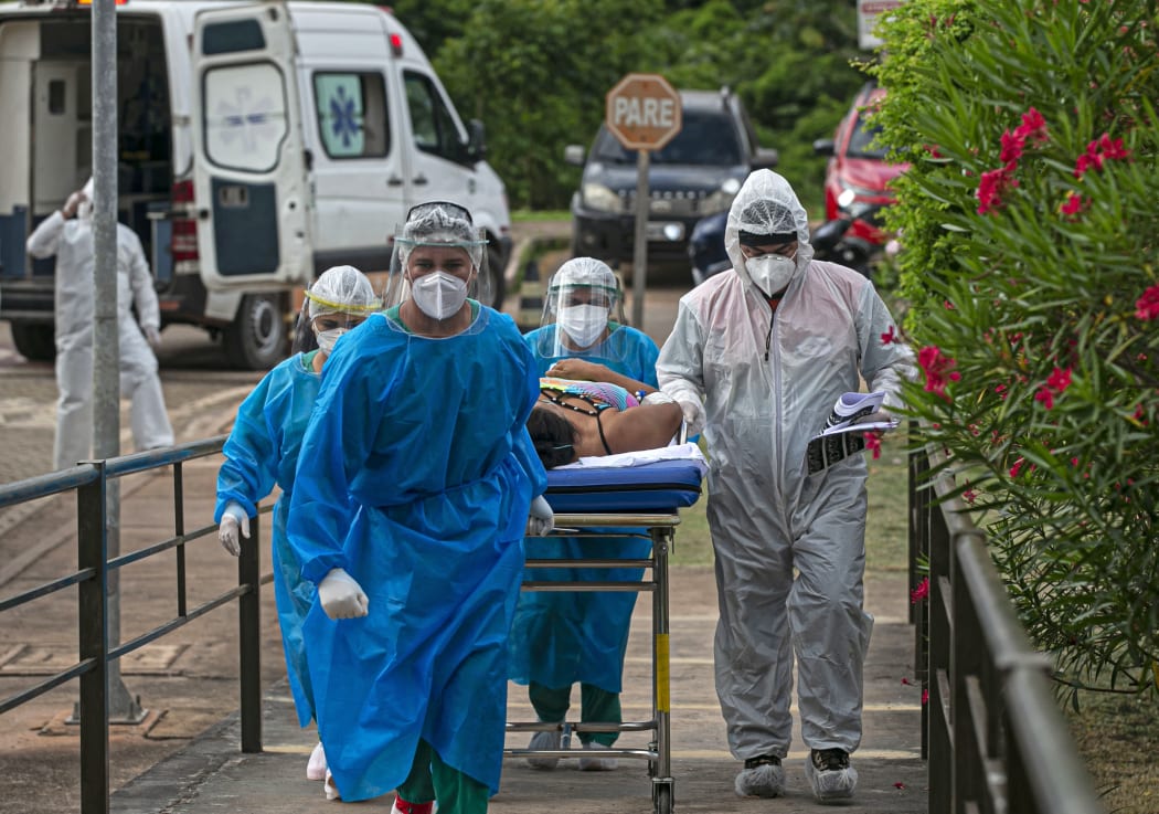 A Covid-19 patient is transferred from the Emergency Care Unit of Santarem, Para state, Brazil, to another hospital of Para, on February 7, 2021.
