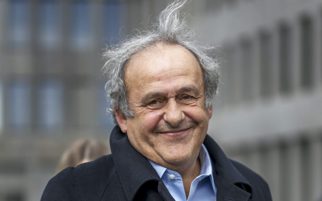 Former UEFA president Michel Platini smiles when leaving the courthouse, 2025.