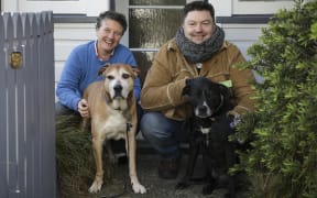 Dogs Charlie and Betty with their owner Katherine Short, and borrower Justin Meade