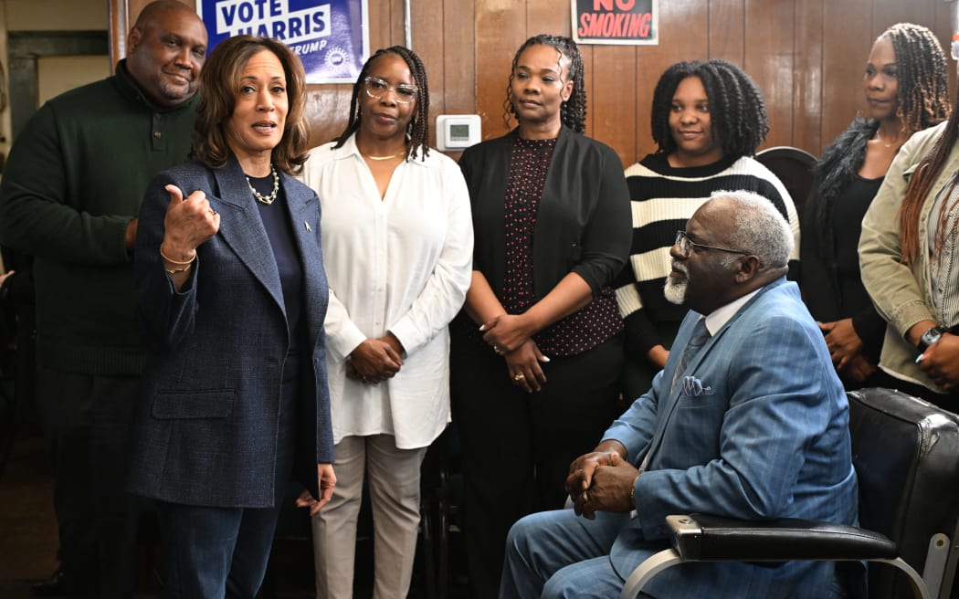 US Vice President and Democratic presidential nominee Kamala Harris speaks during a stop at Elam's Barber Shop in Pontiac, Michigan, on November 3, 2024. (Photo by ROBERTO SCHMIDT / AFP)
