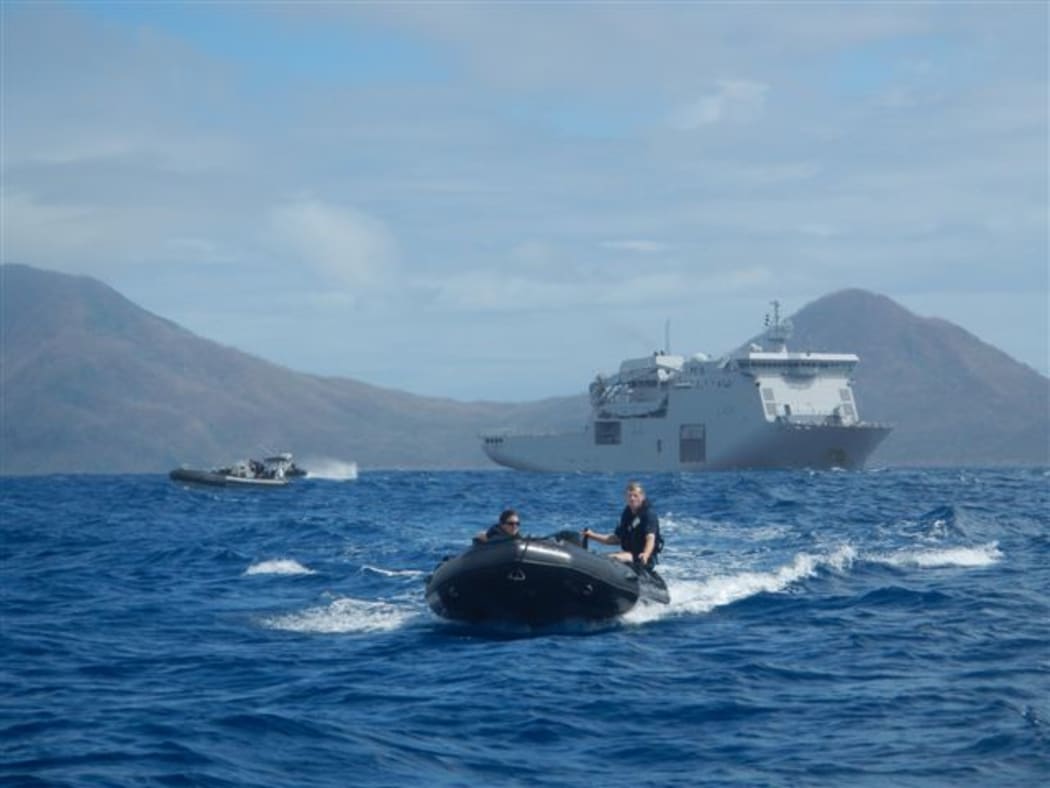 The Marine Survey Team taking Zodiacs ashore with military and USAR reps, then following up with food and water.