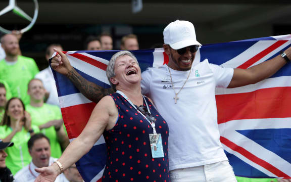 Lewis Hamilton (GBR) Mercedes celebrates the world champion title, with his mother Carmen Larbalestier