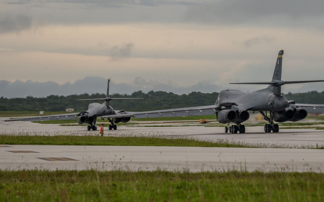 In this US Air Force image obtained from the US Defense Department, two US Air Force B-1B Lancers prepare to take off from Andersen Air Force Base, Guam to fly sequenced bilateral missions with two Japan Air Self-Defense Force (JASDF) F-15s and two Republic of Korea air force (ROKAF) F-15Ks in the vicinity of the Sea of Japan, on October 10, 2017. The US flies two supersonic heavy bombers over the Korean peninsula in a fresh show of force against North Korea's nuclear and missile threats. (Photo by Joshua SMOOT / US AIR FORCE / AFP) / RESTRICTED TO EDITORIAL USE - MANDATORY CREDIT "AFP PHOTO / US AIR FORCE / Staff Sgt. Joshua Smoot" - NO MARKETING NO ADVERTISING CAMPAIGNS - DISTRIBUTED AS A SERVICE TO CLIENTS