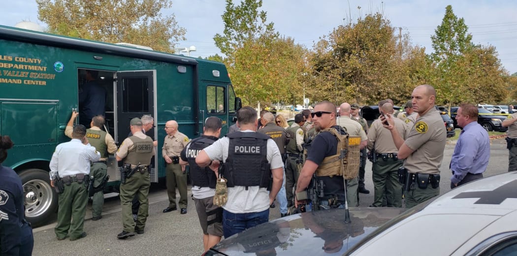 Santa Clarita Valley branch sheriffs gather near Saugus High School where a shooting has taken place.