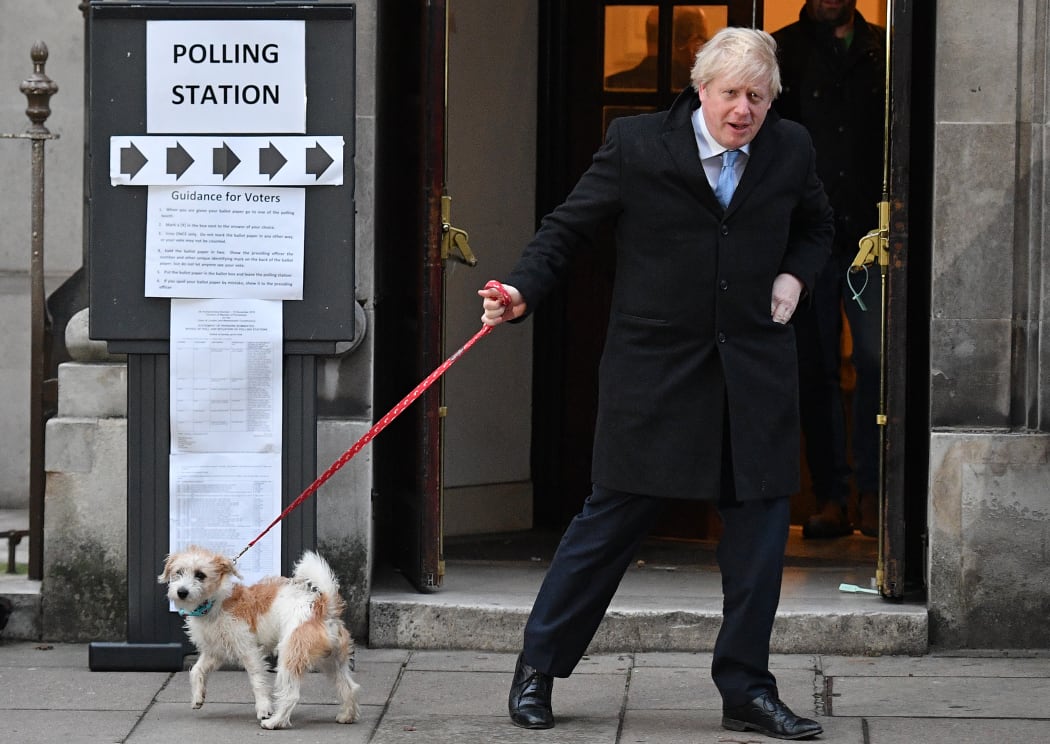 Boris Johnson - with his dog Dilyn  - leaves a polling station voting.