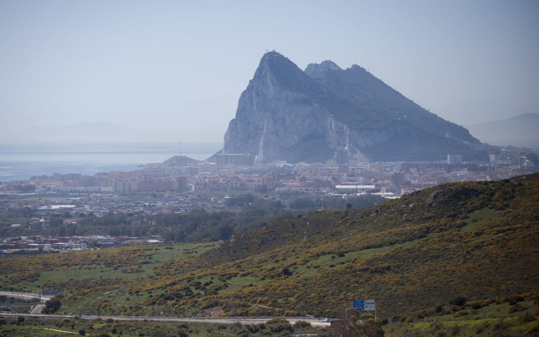 The Gibraltar Rock is pictured from La Linea de la Concepcion near ther southern Spanish city of Cadiz on March 28, 2017.