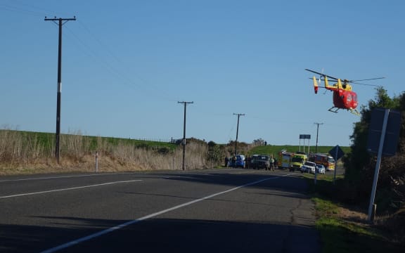 A rescue helicopter takes off from the scene of a crash that claimed five lives.