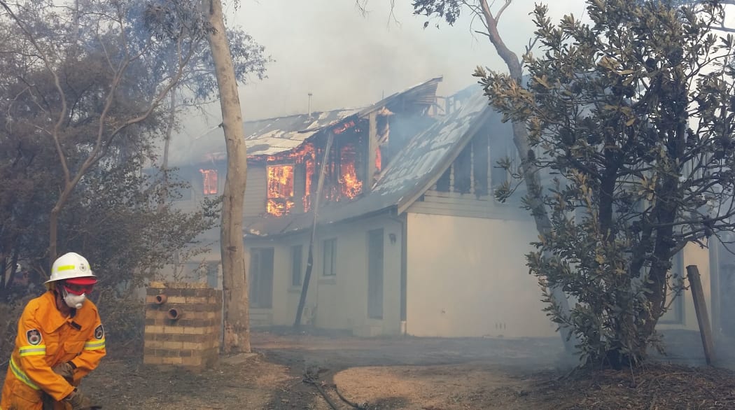 Houses alight at the scene of the bushfire in Katoomba.