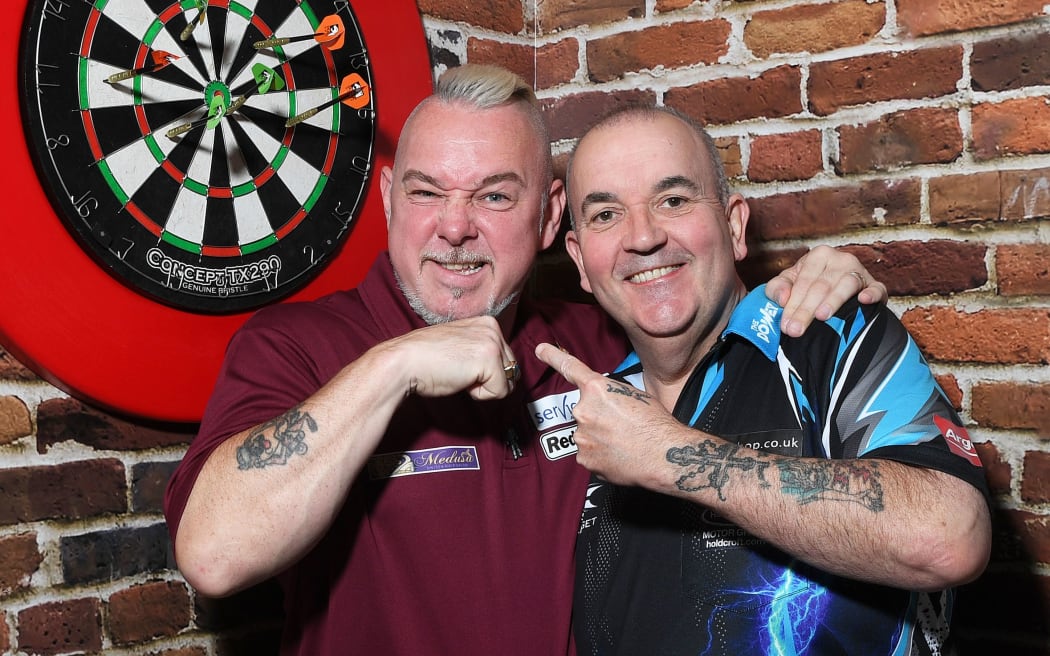 Peter Wright aka Snakebite with Phil " the power" Taylor.
