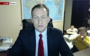 Prof Kelly's live TV interview crashed by his kids.