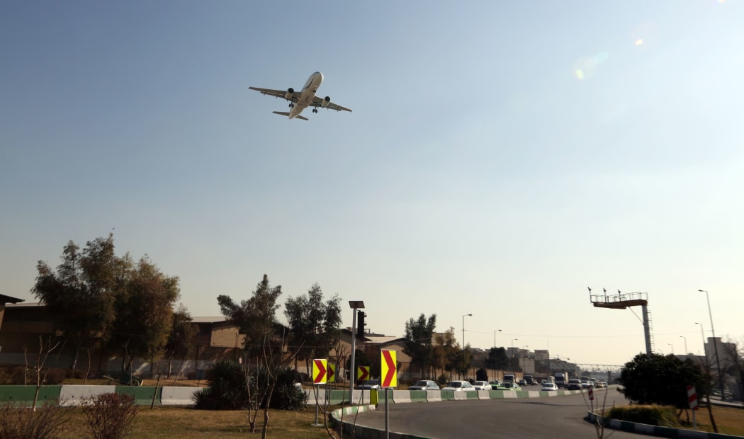 A passenger plane prepares to land at Mehrabad airport in the Iranian capital Tehran.
