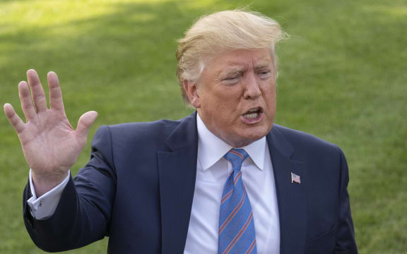 Donald Trump speaks to the media prior to departing the South Lawn of the White House in Washington, DC for a weekend trip to the Trump National Golf Club in Bedminster, New Jersey, 2 August 2019.