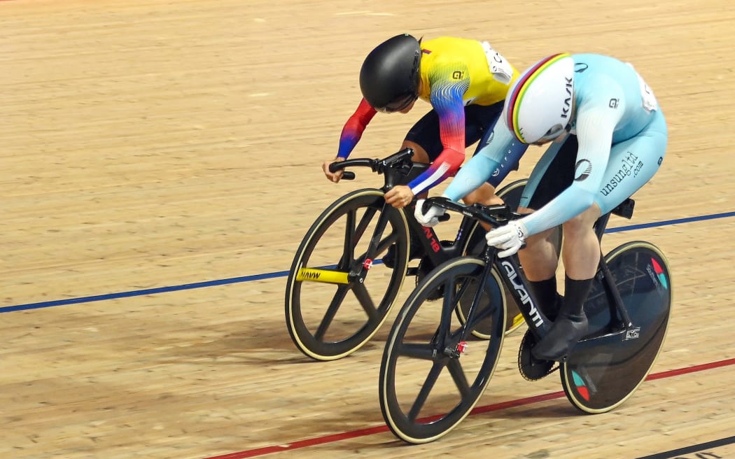 New Zealand's Ellesse Andrews in the competition leader’s blue suit, and Colombia’s Martha Bayona in the women’s keirin final of the UCI track cycling meet in London.