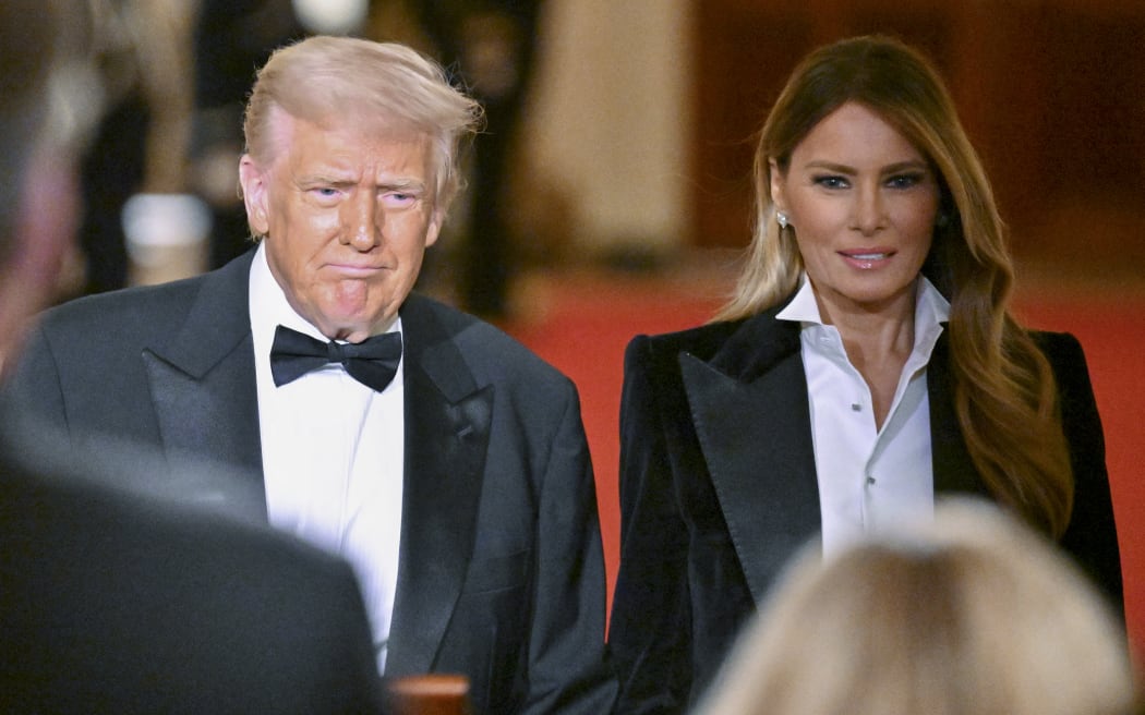 US President Donald Trump and US First Lady Melania Trump arrive for the National Governors Association Evening Dinner and Reception in the East Room of the White House in Washington, DC, on February 22, 2025. (Photo by ROBERTO SCHMIDT / AFP)