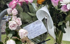 A floral tribute left for Susan Knowles at the Mt Maunganui landslide cordon.