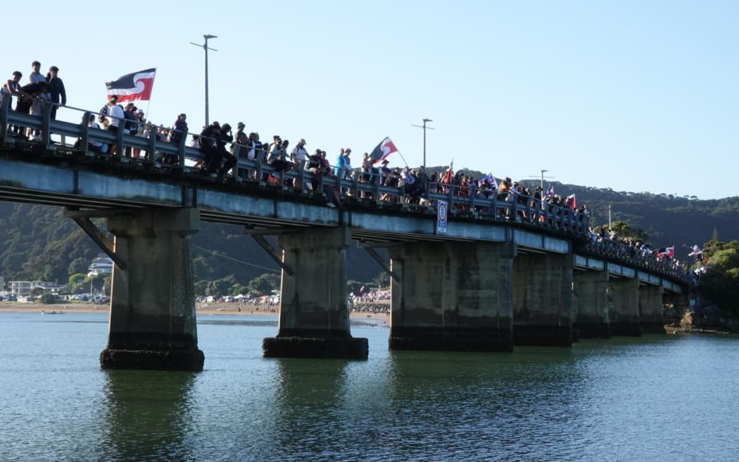 Crowds are gathering on Waitangi Bridge for the waka parade.