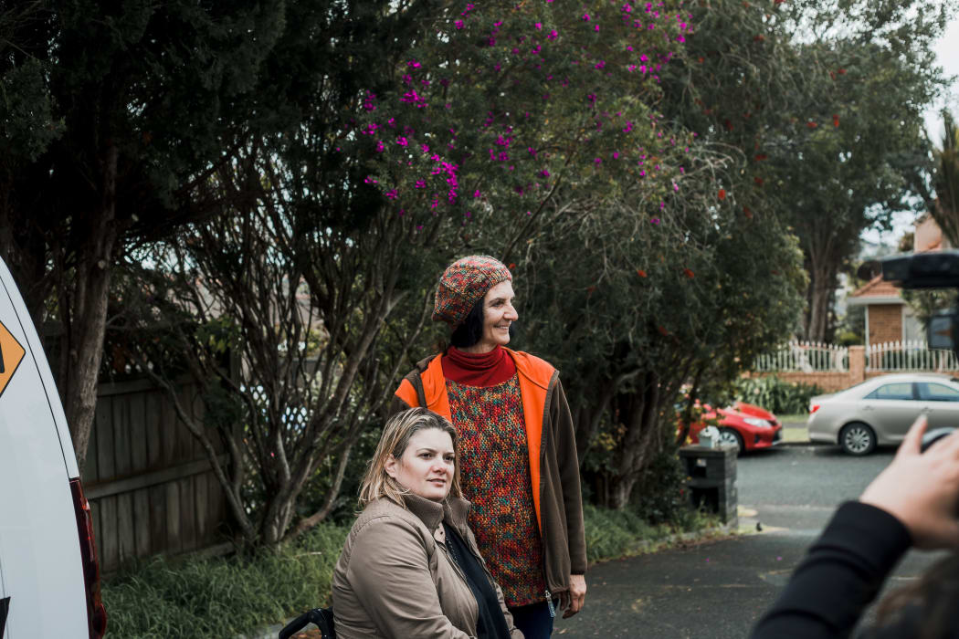 Nadmea and Juliana on their driveway