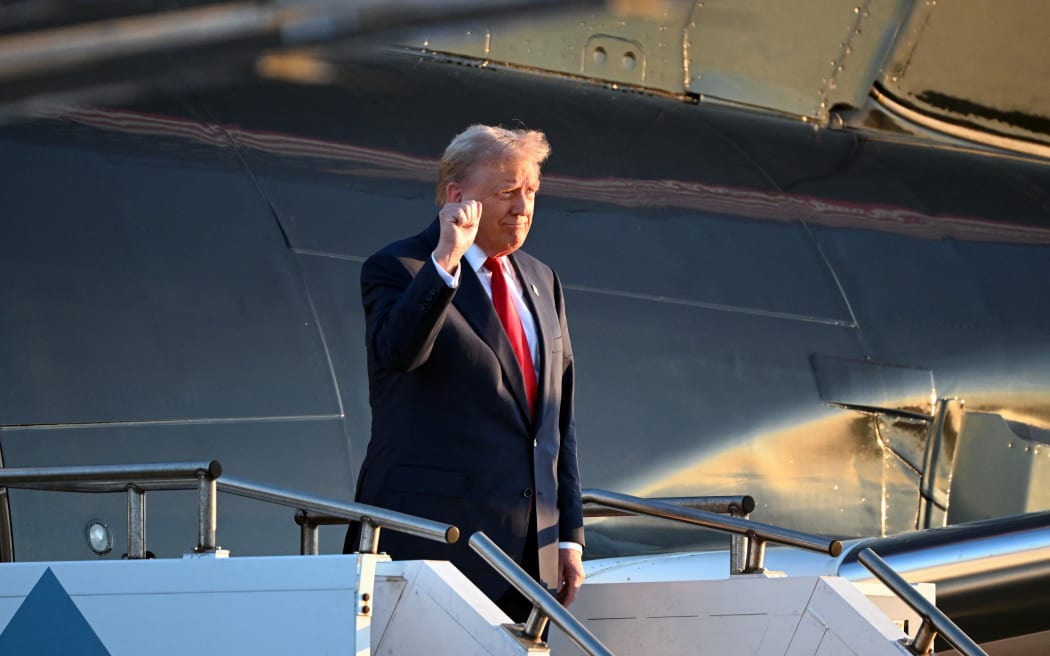 Former US President and Republican presidential candidate Donald Trump steps off his plane upon arrival at Philadelphia International Airport in Philadelphia, Pennsylvania on September 10, 2024. Kamala Harris and Donald Trump are poised to face off in a high-stakes televised debate September 10, 2024, a potentially game-changing moment less than two months ahead of the US presidential election. (Photo by ROBERTO SCHMIDT / AFP)
