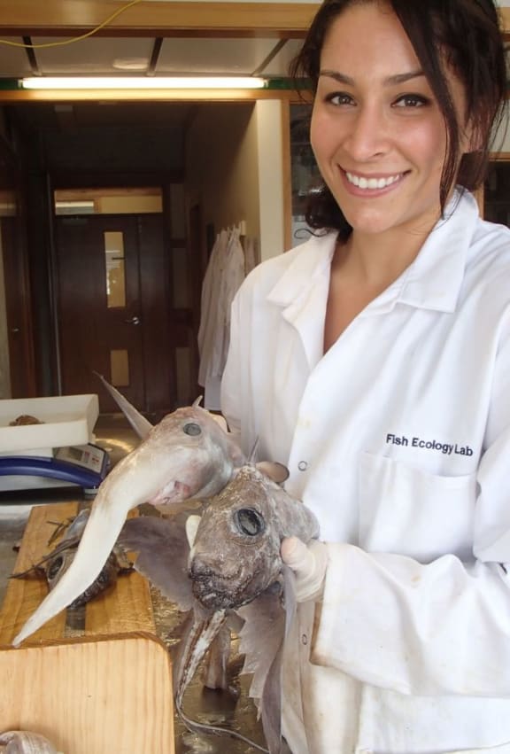 Brit Finucci holding a long nose spookfish and a brown chimaera