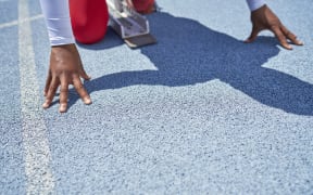 Close-up of hands of female track and field athlete at starting block. (Photo by Trevor Adeline/CAIA IMAGE/SCIENC / NEW / Science Photo Library via AFP)