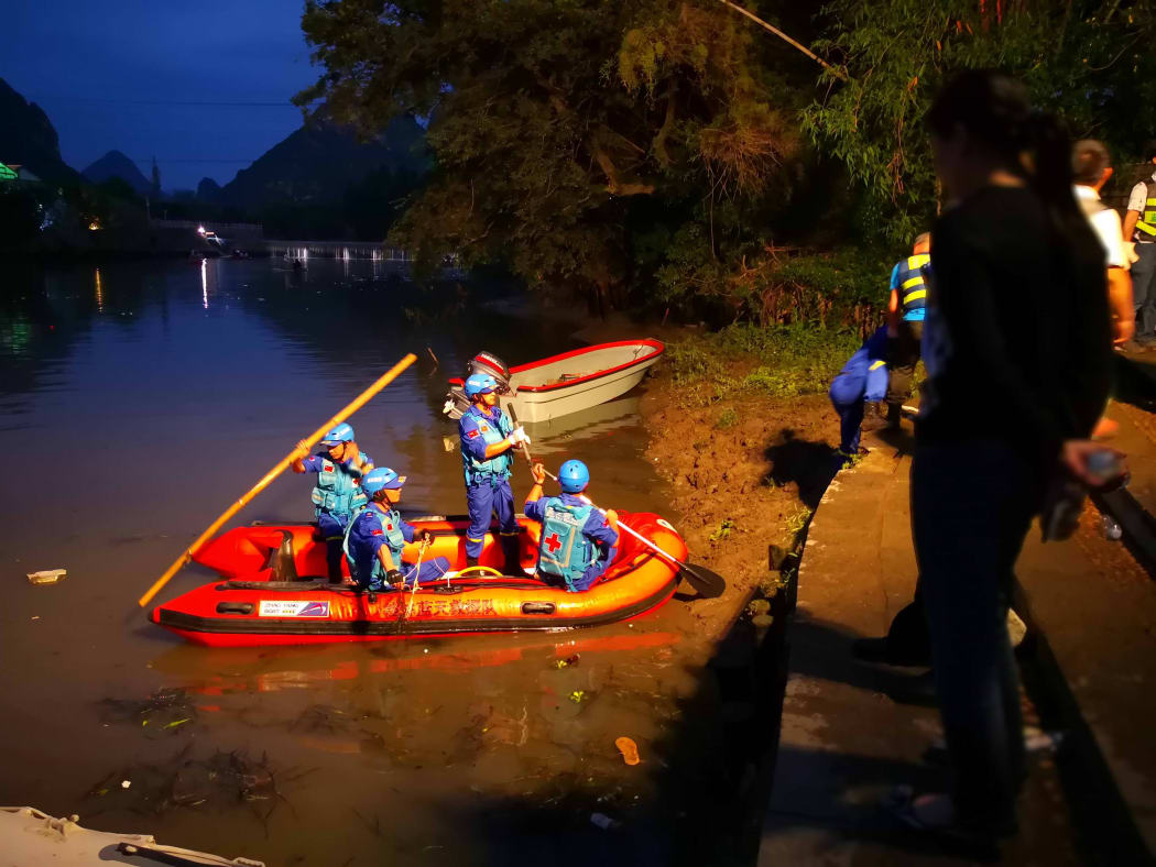 Rescuers patrol to look for missing people after two boats capsized in Guilin in Southern China, on April 21, 2018.
According to the latest report from the Guangxi Daily, 40 people were rescued, 11 people were killed and 6 were missing. / AFP PHOTO / STR / China OUT
