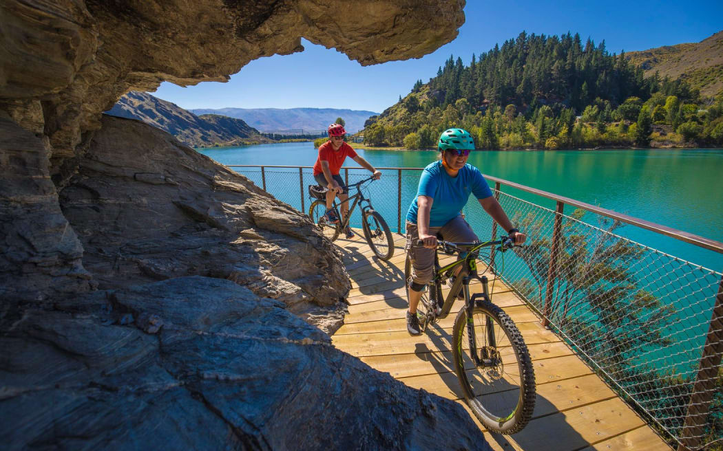 Riders on the Lake Dunstan Cycle track.
