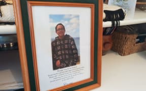 A framed photo of Sonny Marks sits next to his ashes at Ana Ransfield's home