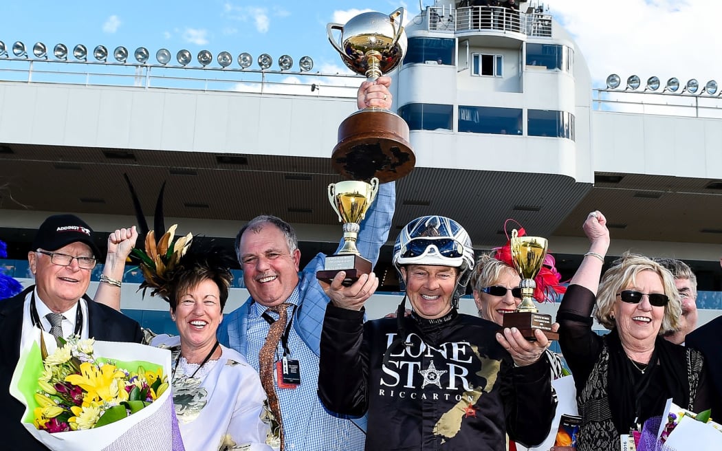 Driver Mark Purdon celebrates with the connections of Lazarus