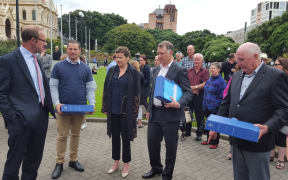 Tauranga-based patient with advanced melanoma, Leisa Renwick, outside Parliament today to present a petition to Health Minister Jonathan Coleman.