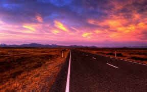 empty country road at sunset