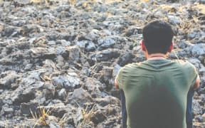 Man looking into the distance.