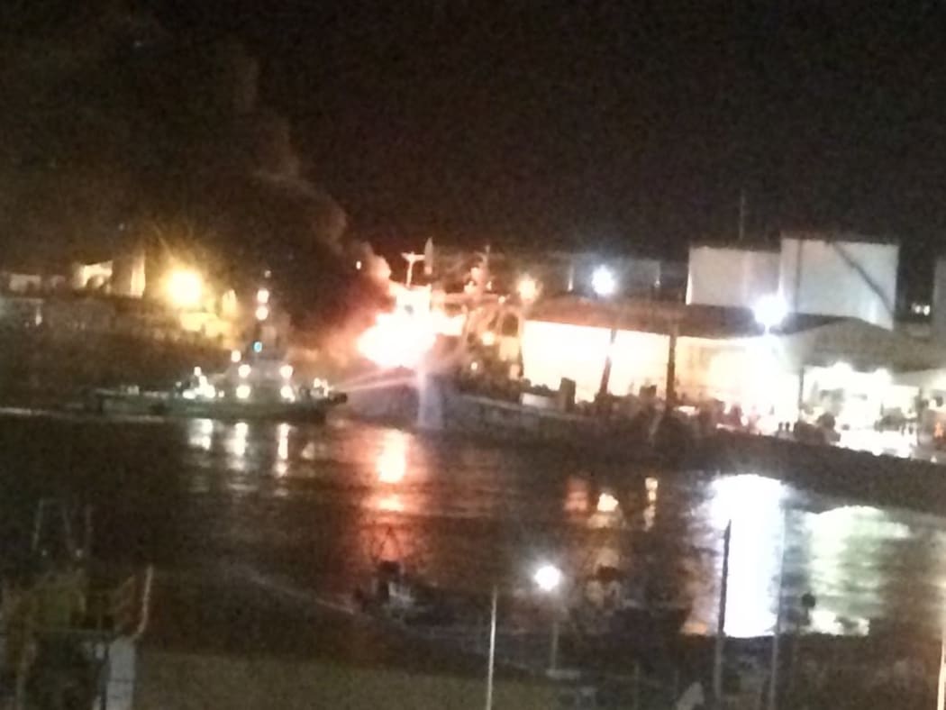Fire crews battling ablaze on board a fishing boat in Timaru port.