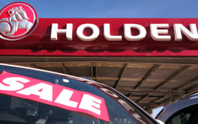 Holden cars sit in the yard of a Holden car dealership in Sydney.