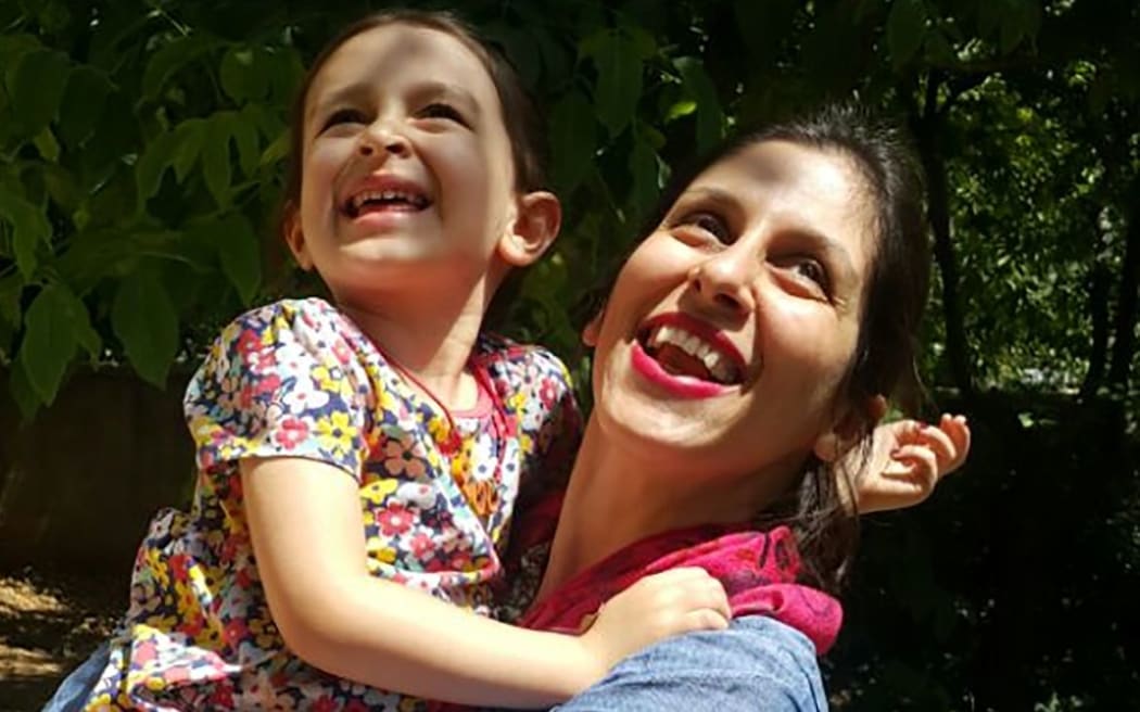 A handout picture released by the Free Nazanin campaign on August 23, 2018 shows Nazanin Zaghari-Ratcliffe (R) embracing her daughter Gabriella in Damavand, Iran following her release from prison for three days.