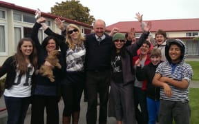 Staff and pupils at Phillipstown School celebrate.