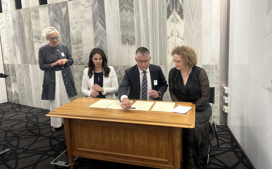 IHC chief executive Andrew Crisp with Minister for Education Erica Stanford (L) and secretary for education Ellen MacGregor Reid.
